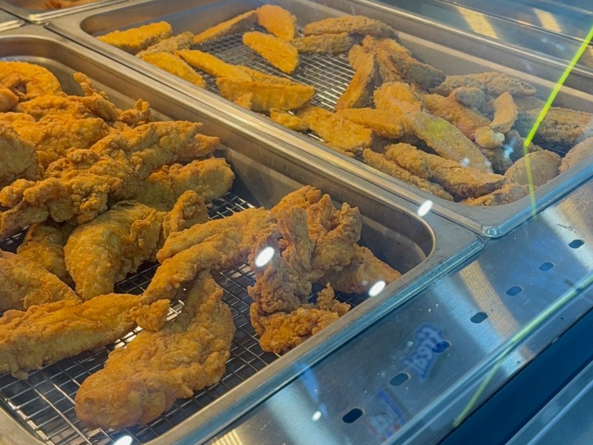 Golden fried chicken tenders in the Chester's Chicken hot case